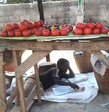 Young Boy Selling Vegetables